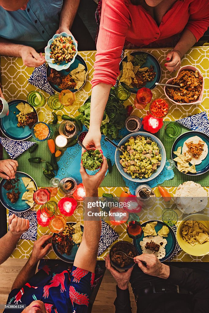 Friends having a Mexican tex mex dinner