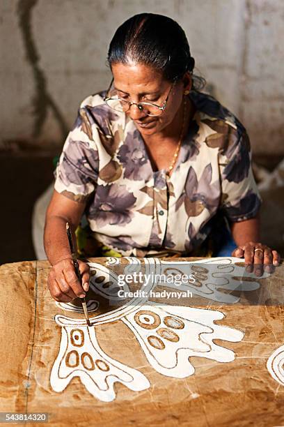 sri lankan woman making batik near kandy - batik painting stock pictures, royalty-free photos & images