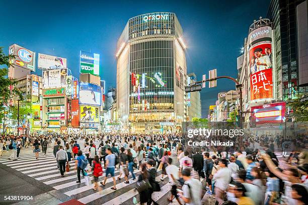 shibuya crossing in tokyo, japan - pedestrian crossings stock pictures, royalty-free photos & images