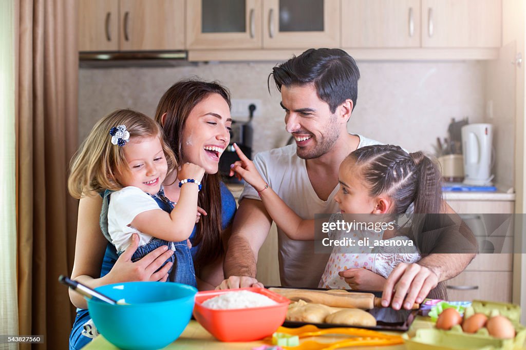 Happy family baking cookies