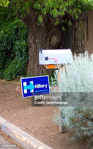 politcal poster "hillary" near curb, mailbox, and vegetation - rabbit brush stock pictures, royalty-free photos & images