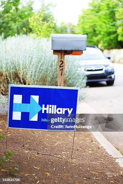 politcal poster "hillary" near street, mailbox, and car - rabbit brush stock pictures, royalty-free photos & images