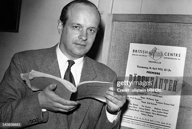 Willems, Paul - Playwright, BelgiumPortrait in front of a placard announcing the premiere of his play 'Der Baerenhaeuter' in Berliin - Photographer:...