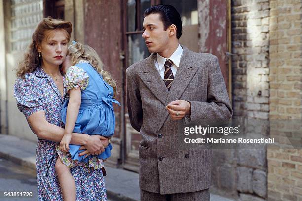 French actress Isabelle Huppert, her daughter Lolita Chammah and actor Nils Tavernier on the set of "Story of Women" by French director, screenwriter...