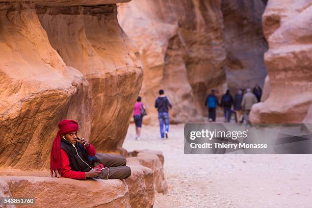 Petra, Ma'an Governorate, Jordan, February 7, 2014. -- Tourists are walking in the narrow passage that leads to Pétra. Petra is a historical and...