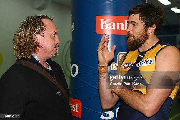 Former Eagles player Daniel Chick talks with Josh Kennedy of the Eagles after the round 15 AFL match between the West Coast Eagles and the Essendon...