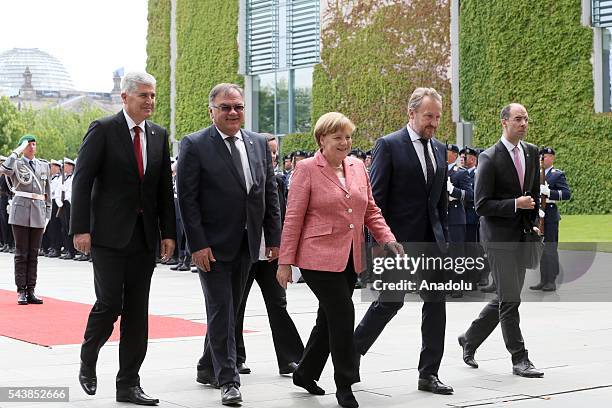 Germany's Chancellor Angela Merkel welcomes Bosnian members of the Tripartite Presidency of Bosnia and Herzegovina Dragan Covic , Mladen Ivanic and...