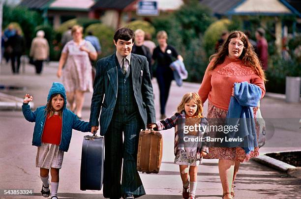 Young family anongst the thousands of arrivals for the Saturday turnaround in Butlins holiday camp, Skegness. Butlins Skegness is a holiday camp...