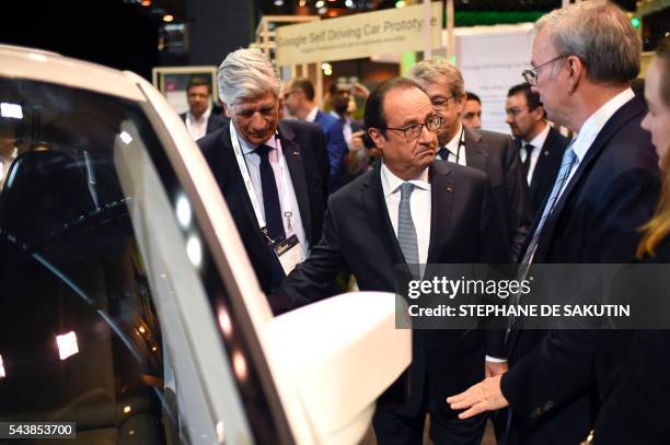 Alphabet Inc Executive Chairman Eric Schmidt gestures as he talks to French President Francois Hollande , next to Publicis Group Directory Board...