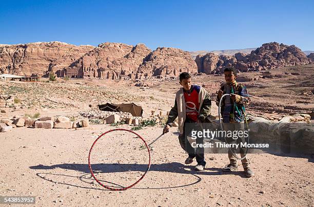 Petra, Ma'an Governorate, Jordan, February 7, 2014. -- Childs practice Hoop rolling in Pétra. Petra is a historical and archaeological city in the...