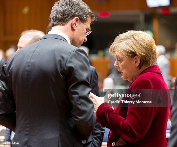 Brussels, Belgium, March 6, 2014. -- Dutch Prime Minister Mark RUTTE is talking with the German Chancellor ANgela MERKEL prior an EU chief of state...