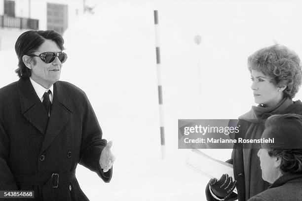 French director Jean-Pierre Mocky on the set of his film "Agent Trouble" with French actors Catherine Deneuve and Pierre Arditi.