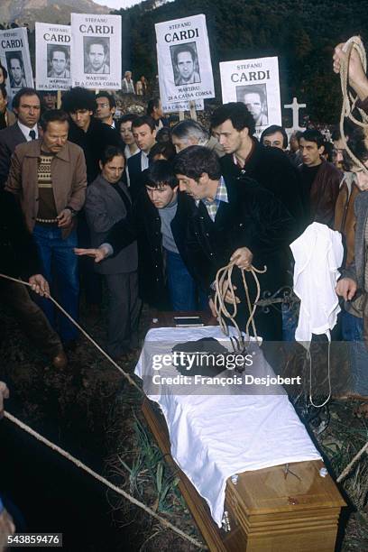 Serriera, Corsica. Agitated funeral for Stefanu Cardi. When his coffin was taken out of the church, covered in a Corsican flag, a gang of masked and...