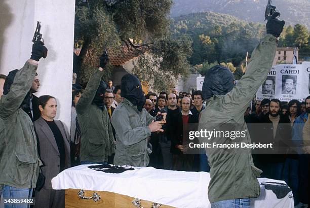 Serriera, Corsica. Agitated funeral for Stefanu Cardi. When his coffin was taken out of the church, covered in a Corsican flag, a gang of masked and...