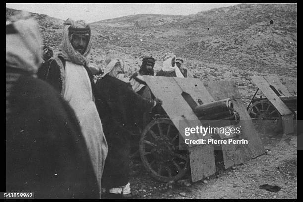 Prince Zeid bin Hussein of Iraq with captured 75mm Austrian mountain guns, Tafilah, in present-day Jordan, during the Arab Revolt against Ottoman...