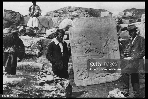 British archaeologist Leonard Woolley and T E Lawrence with a Hittite bas-relief in basalt at the ancient city of Carchemish , Turkey, 1913.