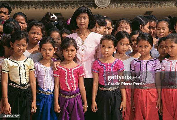 Cambodian Prince Norodom Sihanouk's daughter, Buppha Devi with Cambodian children.