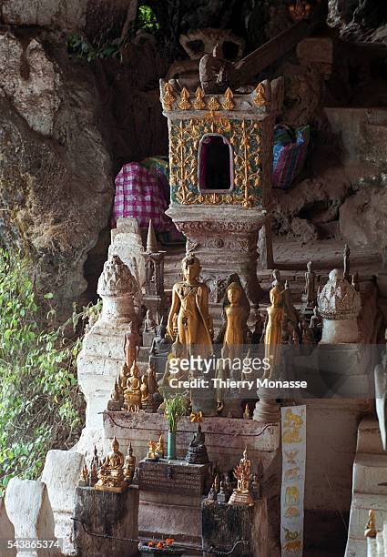 Pak Ou Caves, Laos, August 2003. -- The Pak Ou Caves, 25 km to the north of Luang Prabang. The caves are noted for their miniature Buddha sculptures....