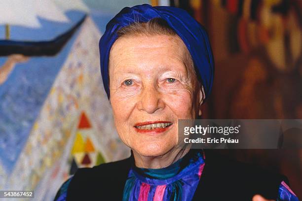 French writer Simone de Beauvoir at the opening of her sister's, Helène de Beauvoir, exhibition of paintings.