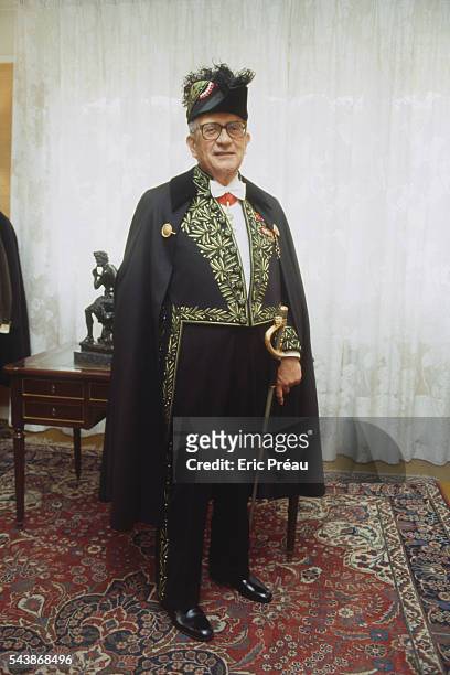 French Americanist, ethnologist, politician and essayist Jacques Soustelle dressed in the gold silk-embroidered suit of an academic, with cape, sword...