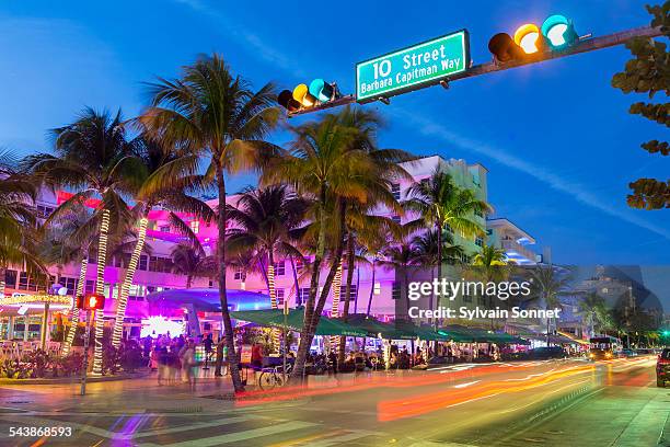 neon lights on ocean drive. - miami beach stock pictures, royalty-free photos & images