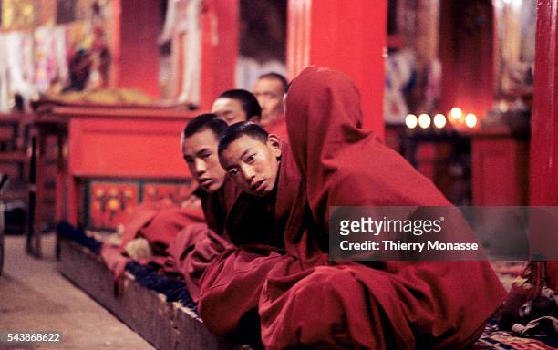 Zhongdian, Shangri-La, County, People's Republic of China, April 1997. -- Monks are praying in Songzanlin Temple