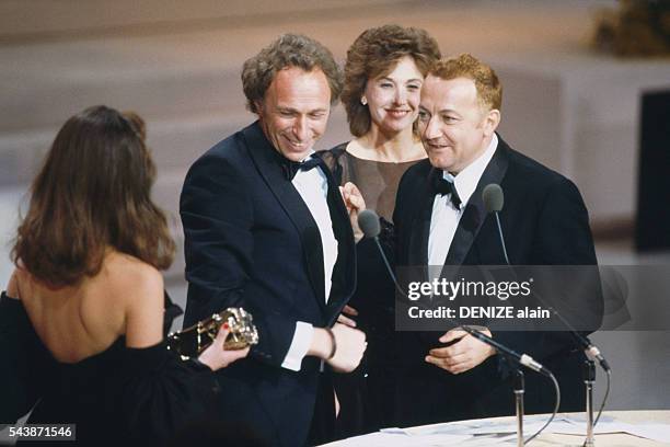 French comedian Coluche attends the 1984 César award ceremony to receive an award for Best Actor in the movie "Tchao Pantin". The award is presented...