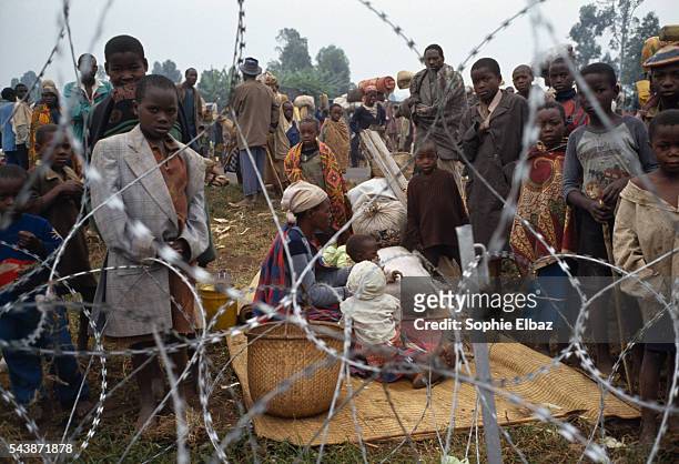 Rwandan orphans are evacuated from Gyeri in Zaire by French peacekeeping forces taking part in "Operation Turquoise." Fighting between rival Tutsis...