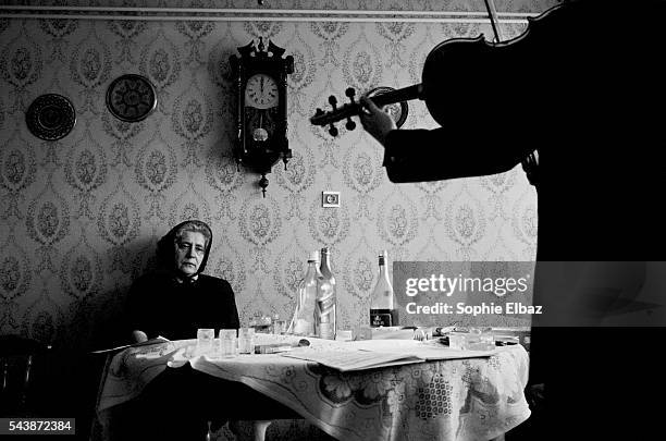 In the village of Sisak, located on the north Croatian battlefront in 1992, a woman listens to a tribute to her only son, who died at the age of 18...