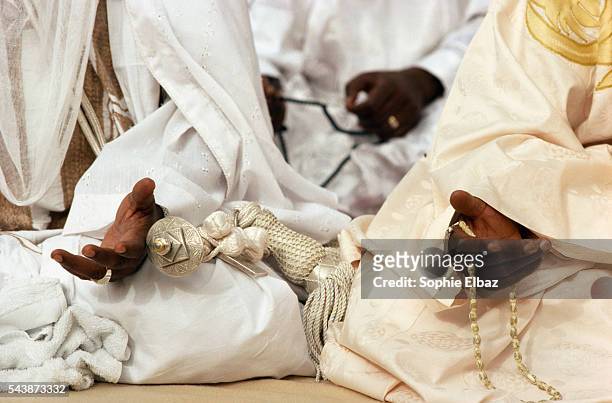 The Emir , his brother and the governor pray together.