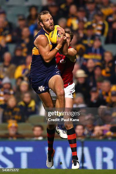 Will Schofield of the Eagles marks the ball during the round 15 AFL match between the West Coast Eagles and the Essendon Bombers at Domain Stadium on...