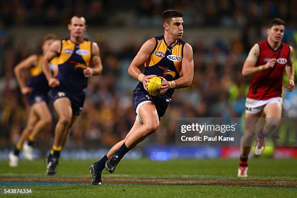 Elliot Yeo of the Eagles runs with the ball during the round 15 AFL match between the West Coast Eagles and the Essendon Bombers at Domain Stadium on...