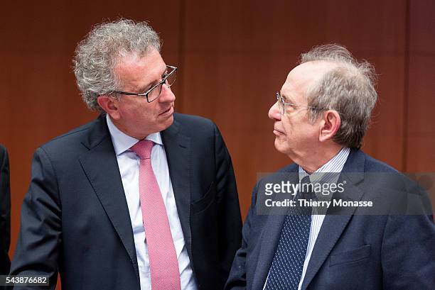 Brussels, Belgium, November 6, 2014. -- Luxembourg Minister of Finance, Treasury, & Budget Pierre GRAMEGNA is talking with the Italian Minister...