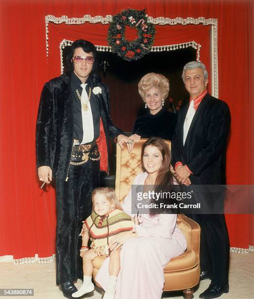 American rock legend Elvis Presley with his wife Priscilla, their daughter Lisa Marie, and Presley's personal doctor George Nichopoulos and his wife.