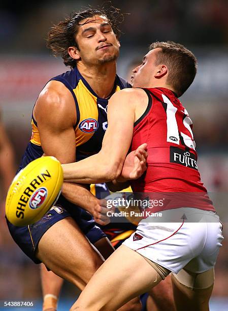 Sharrod Wellingham of the Eagles gets tackled by Orazio Fantasia of the Bombers during the round 15 AFL match between the West Coast Eagles and the...