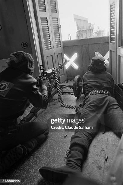 Muslim fighters take cover behind the balconies of Beirut.