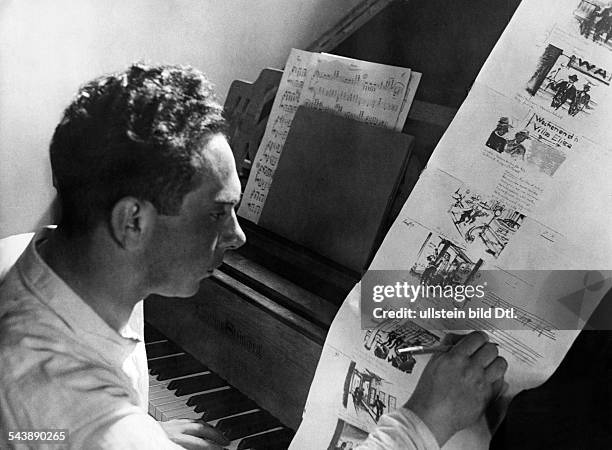 Preparations for filming , Creation of a storyboard: A composer writing the music of the scene in a script - ca. 1932- Photographer: Weltrundschau,...