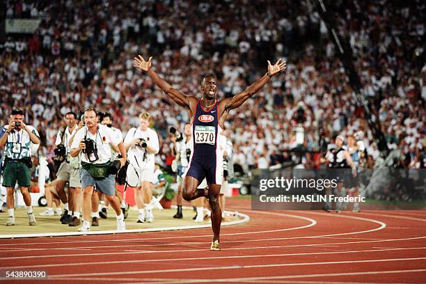 Sprinter Michael Johnson celebrates after winning the men's 200-meter run, setting a world record of 19.32 seconds at the 1996 Atlanta Olympic Games.