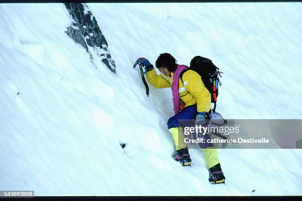 French rock climber Catherine Destivelle climbs the Eiger , in the Bernese Alps in Switzerland.