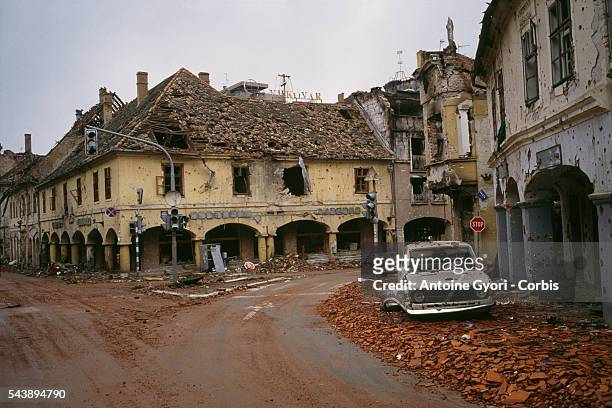 Bombed buildings are riddled with bullet holes and streets are filled with rubble after a three-month battle between the Croatian armed forces and...