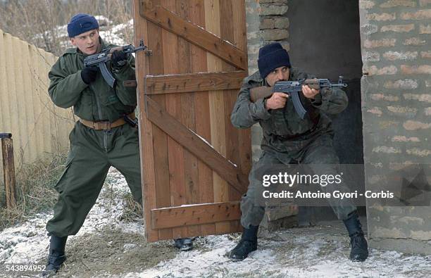 Members of the Serbian Volunteer Guard, or "Arkan's Tigers," perform training exercises in Erdut during the Yugoslavian Civil War. In 1997, the...