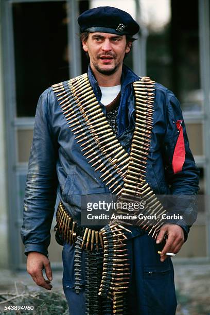 Member of the Serbian Volunteer Guard, or "Arkan's Tigers," wears ammunition during training exercises in Erdut during the Yugoslavian Civil War. In...