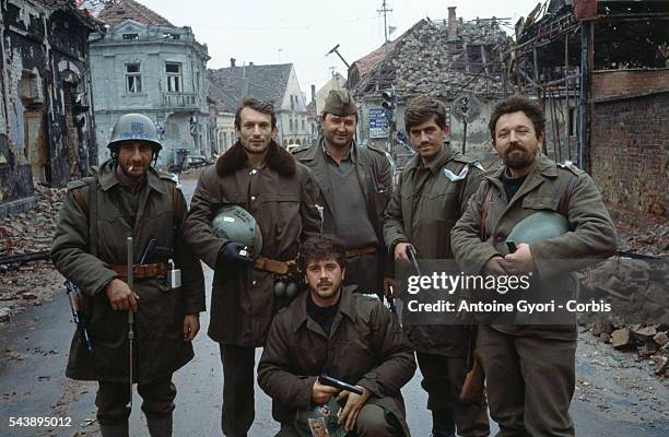 Serbian fighters stand among the ruins of Vukovar after a three-month battle between the Croatian armed forces and the Yugoslavian Federal Army which...