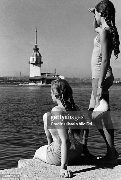 Turkey Istanbul Istanbul Two girls standing on the river bank of the Bosphorus - ca. 1939- Photographer: Regine Relang- Published by: 'Die Dame'...
