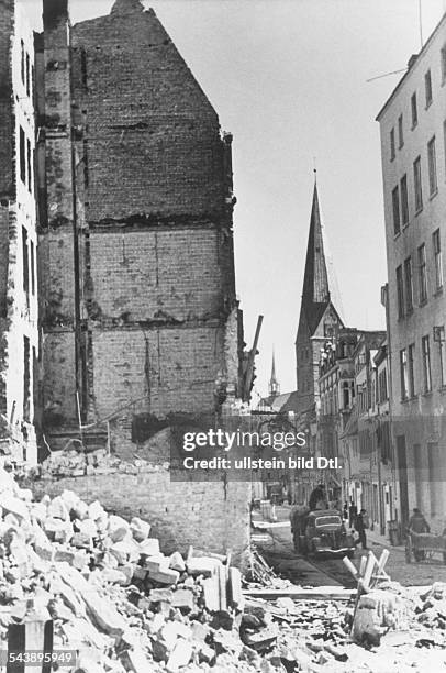 World war, germany during .....Bomb raid on Luebeck 29.March 1942.house ruins in a city street.April 1942