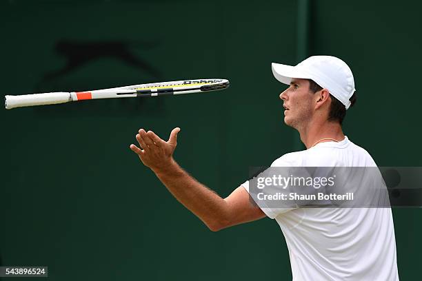 Dennis Novikov of the United States reacts during the Men's Singles second round match against Joao Sousa of Portugal on day four of the Wimbledon...