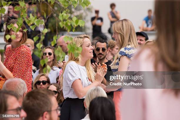 Fashion Designer Marina Hoermanseder and models aknowledge the applause of the guests at the Marina Hoermanseder show during the Mercedes-Benz...
