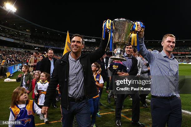 Drew Banfield and Adam Selwood walk a lap of honour with team mates celebrating the West Coast Eagles 2006 Premiership anniversary during the round...