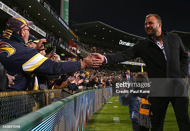 Steven Armstrong walks a lap of honour with team mates celebrating the West Coast Eagles 2006 Premiership anniversary during the round 15 AFL match...