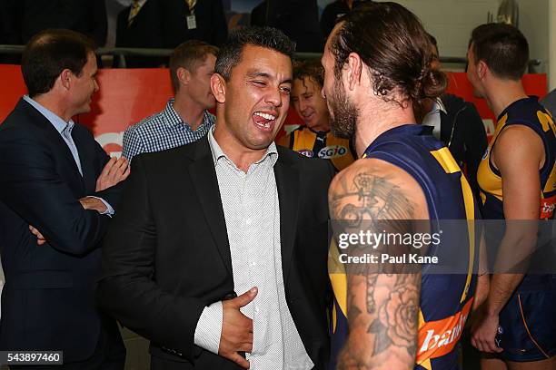Former Eagle Daniel Kerr talks with Chris Masten of the Eagles after the round 15 AFL match between the West Coast Eagles and the Essendon Bombers at...